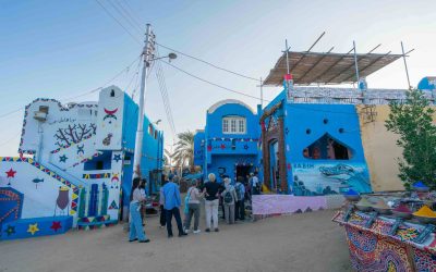 Tourists lined up to see captured baby crocodiles in the Nubian Village in Aswan